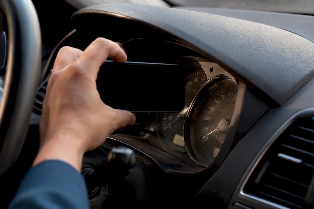 Hand photographing car odometer display